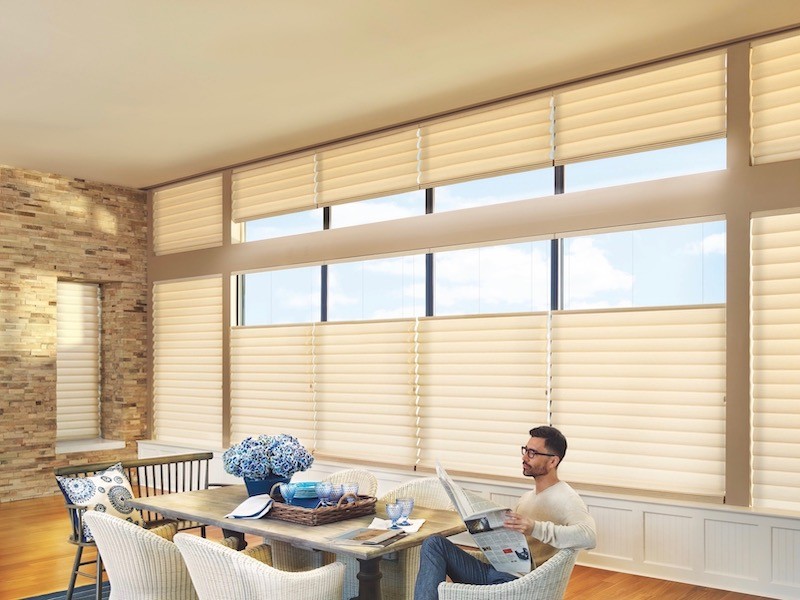 Dinning room with man reading top down bottom up shades